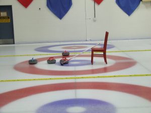 Red hit the ice at the local curling club for another new winter sport